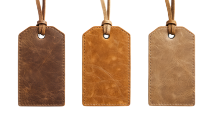 A set of three vintage leather tags with distinct textures and colors, each featuring a loop for attachment.