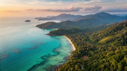 Koh Chang Beach Island Satun Thailand Aerial view of a coastal landscape featuring lush greenery and calm turquoise waters at sunset.
