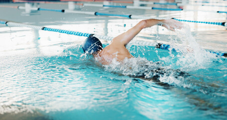 Swimming, man and fitness for athlete, active and practice for competition, healthy and routine in pool. Cardio, training and performance of person in water, exercise or swimmer with energy for sport