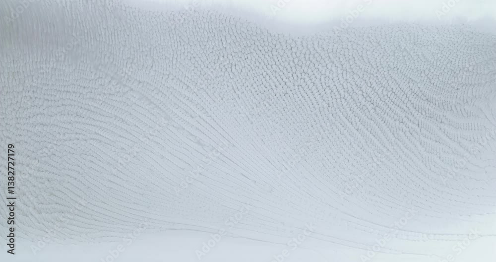 Wall mural alcohol ink is creating an abstract chemical reaction with its particles flowing on a grey backgroun