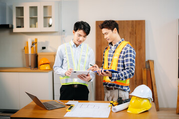Engineer teams meeting working together wear worker helmets hardhat with on architectural project site and making model house.
