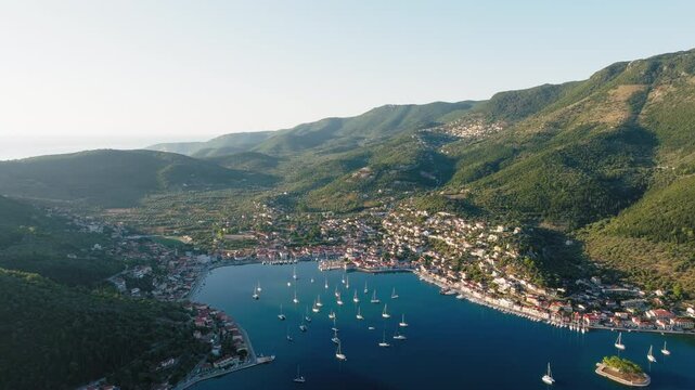 Vathy on Ithaca Island during sunrise surrounded by mountains and Ionian Sea, Drone shot