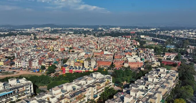 Aerial view of an Indian City and agricultural fields near the Delhi-Chandigarh Highway in Punjab, India. Natural texture for the background. The picturesque countryside of India. Healthy food concept