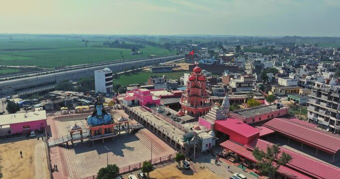 Aerial view of an Indian City and agricultural fields near the Delhi-Chandigarh Highway in Punjab, India. Natural texture for the background. The picturesque countryside of India. Healthy food concept