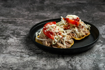 Delicious Pulled Pork Tostadas with Cabbage, Tomato, and Cheese