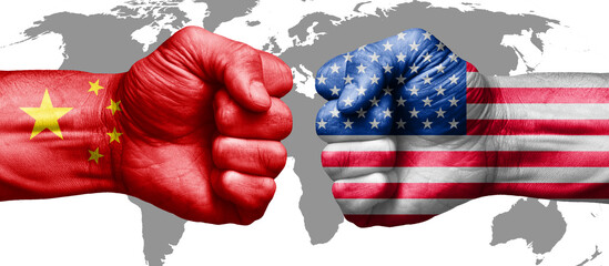 american flag fist against chinese flag fist. concept of us versus china in business and trade war	