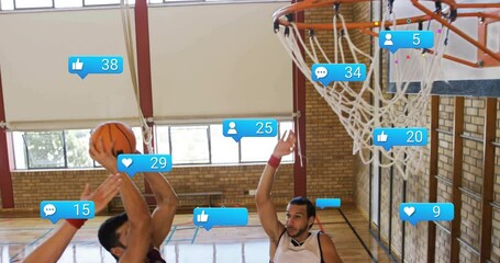 Shooting basketball, players with animation of social media notifications overlaying scene - Powered by Adobe