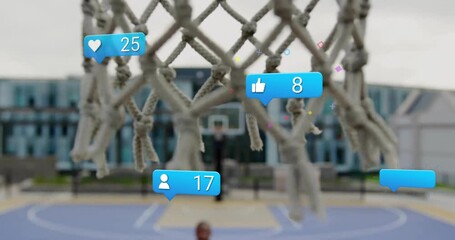 Animation of basketball hoop with social media icons for likes and comments - Powered by Adobe