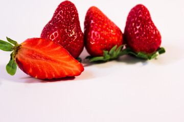 minimalistic photo of ripe and juicy strawberries on a white background