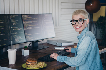 Young Female Programmer Working on Code in a Modern Home Office Setting