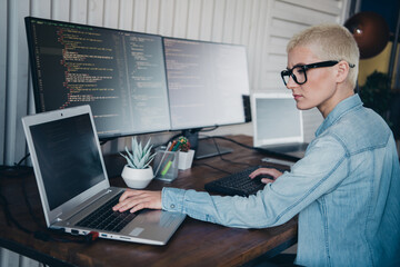 A Young Professional Woman Programming on Laptop in a Modern Home Office