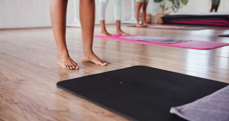 Mat, feet or legs of woman in yoga class for flexibility or wellness or balance in training. Start,...