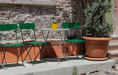 colorful, vibrant photographs taken on a summer day on Cunda Island. Green chairs, doors, walls. Vintage designs of restaurants and cafes in touch with nature.