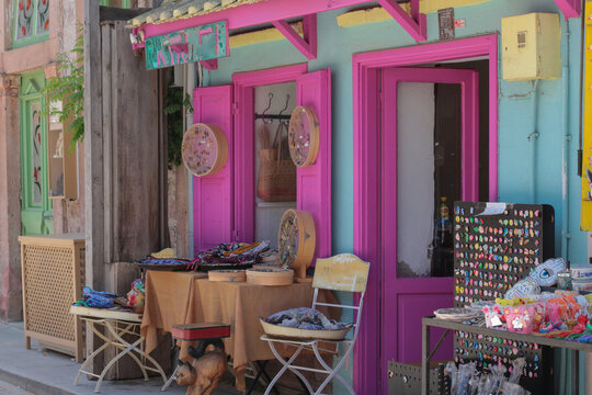 colorful, vibrant photographs taken on a summer day on Cunda Island. Pink, blue, turquoise doors, walls. Vintage designs of restaurants and cafes in touch with nature.