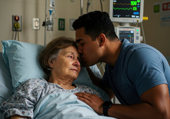 Obraz premium A tender moment of love and care: A young man kisses an elderly woman's forehead in a hospital bed.