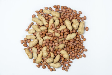 Shelled and Unshelled Peanuts Close-Up Isolated on White