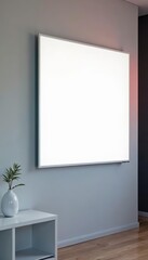 Close-up of a blank white screen LED TV hanging on a wall, perfect for adding custom content , LED, television, blankvtColor