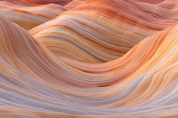 Obraz premium Colorful rock formations in a stunning canyon layered with vibrant hues during golden hour