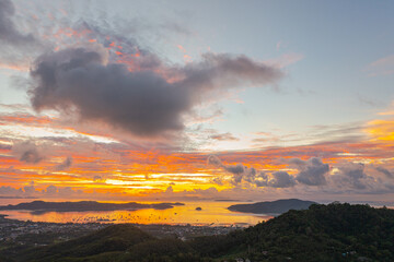 aerial view bright sunrise above Chalong sea Phuket..beautiful cloud over archipelago..lens flare background.  4k stock footage video.