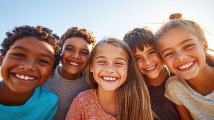 Fototapeta premium Group of kids smiling together outdoors during golden hour