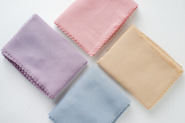 hijab headscarf fabric folded in many color on a white background