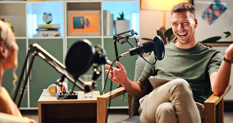 Man, woman and podcast with mic, talking and home studio with smile for live streaming on social...