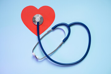 Stethoscope on red heart shape symbolizing cardiovascular health and medical care