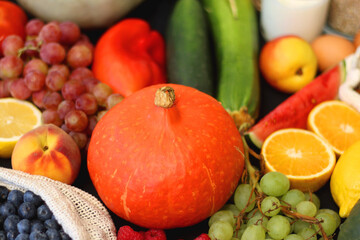 Various healthy fruits, vegetables and cereals on dark background. Selective focus.