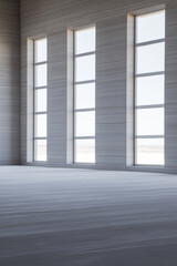Fototapeta premium Sunlight streaming through modern windows in a minimalist interior space at midday