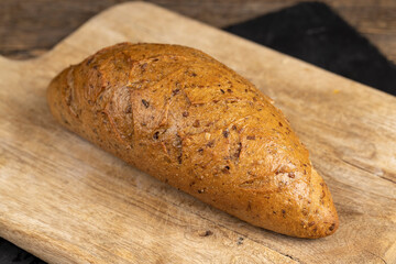 a healthy loaf of soft bread with added seeds and bran