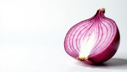 Fototapeta premium Close-up of a red onion's layers, white backdrop, layers, photography