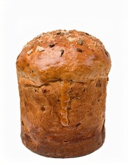 Tall golden panettone bread with nuts and seeds on white background