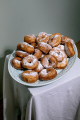 Sugar Dusted Donuts On White Plate