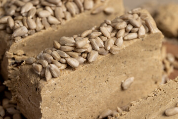 cut halva from sunflower closeup, delicious dessert made from fried sunflower seeds