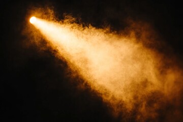 An orange spotlight focuses on the stage, or divine rays are isolated against a dark backdrop