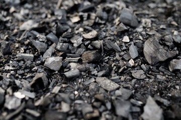 Black Burnt Coal Texture Close-Up. High quality photo