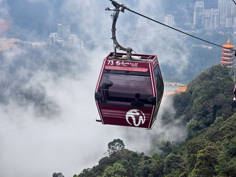 awana skyway cable car with genting highlands hills in the background, one of the attractions and tourist destinations in malaysia