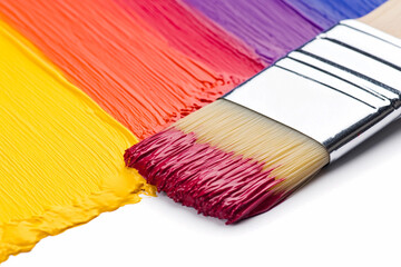 Fototapeta premium Close-up view of a paintbrush dipped in vibrant colors, capturing the creative process in action during art project