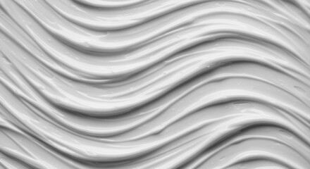 Obraz premium Close-up view of smooth, flowing white cosmetic cream texture.
