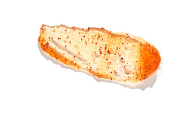 Close up of spicy sauce smear with red pepper flakes and textured cream on white background.