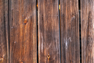 Obraz premium Old rotten boards of a farm building, background made of boards, wood as a background