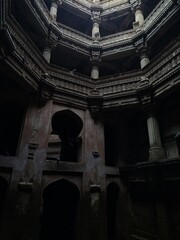 Fototapeta premium Inner view of Adalaj Ni Vav (Stepwell) or Rudabai Stepwell. Built in 1498 by Rana Veer Singh is five stories deep. Ahmedabad, Gujarat, India