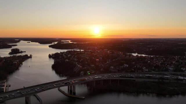 Sunset over the suburbs of Stockholm in late winter, with the many waterways and lakes and the motorway passing in between
