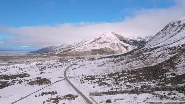 Stunning drone footage of the Tasman River valley in the Mackenzie Basin, South Island, New Zealand. Captured on a clear winter day, showing snow-covered plains, and braided river channels