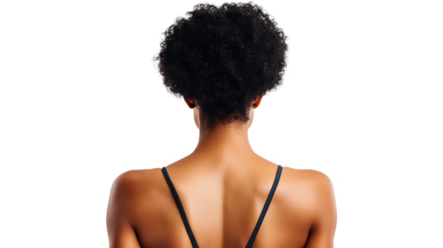 Back of a black woman with afro hair against black backdrop, cut out transparent