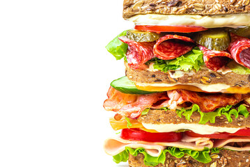 Large mega sandwich with vegetables, meat and cheese