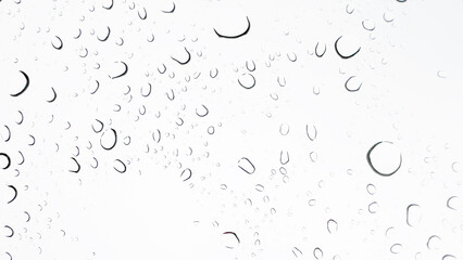 Delicate rain droplets resting on a glass window, reflecting the beauty of nature’s rhythm.