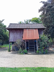 Rustic Wooden Stilt House with Metal Roof Entrance