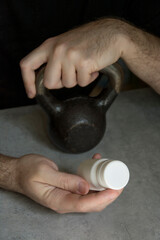 Sportsman holding nutritional supplement jar