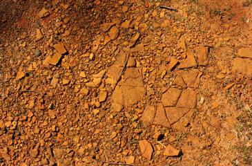 Red Dirt With Rocks and Gravel Background